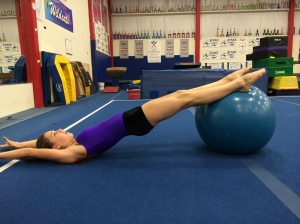 Stability Ball Hamstring Curls  With Arms Overhead- End